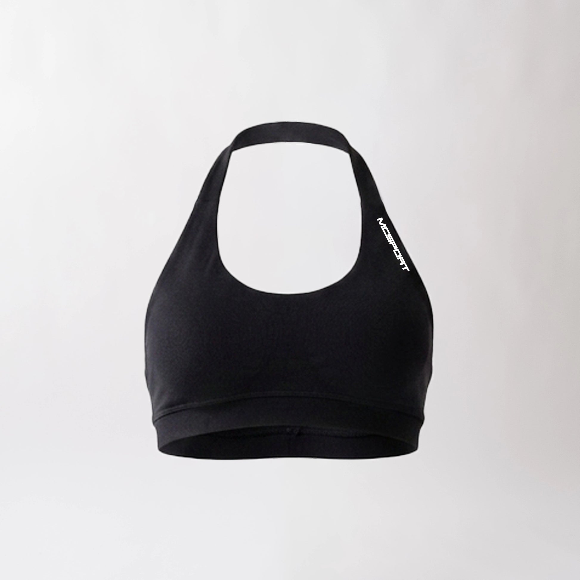 Top sportivo nero da donna dal design essenziale e confortevole, ideale per fitness, palestra, yoga e pilates.